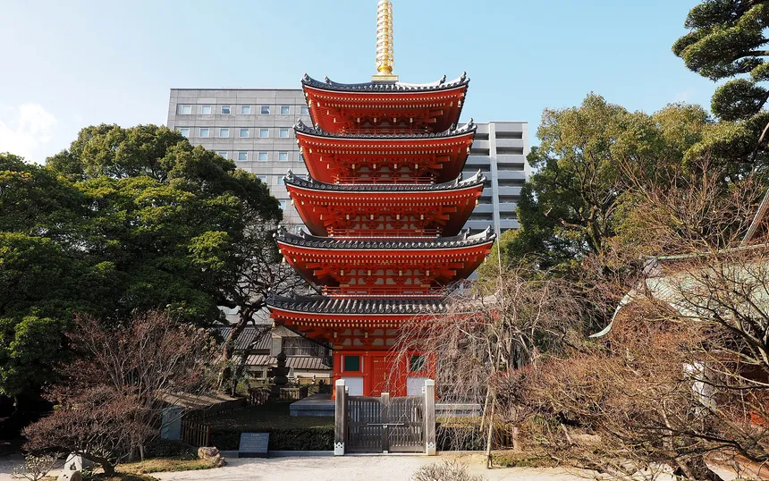The vermilion five-storey pagoda of Tocho-ji, one of the temples on the route, by day