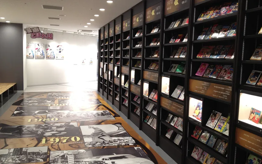 Shelves of manga in the time-tunnel corridor of the Kitakyushu Manga Museum