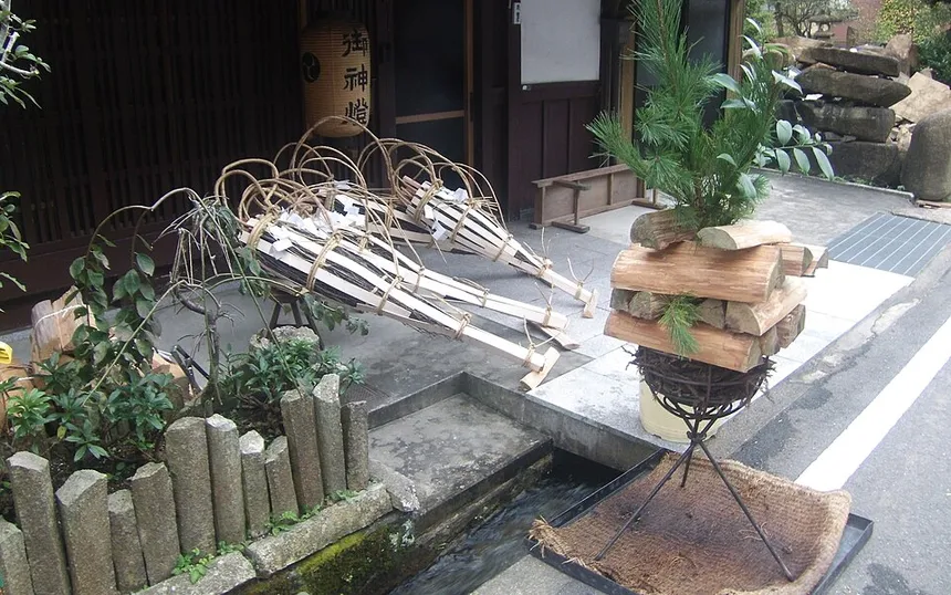 Torches laid out by a stream in Kurama